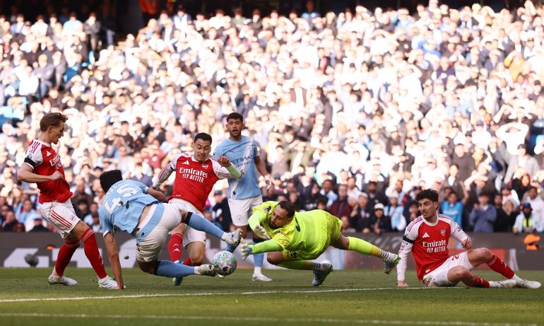 Haaland's strike beats Arsenal, narrowing title gap to three points.